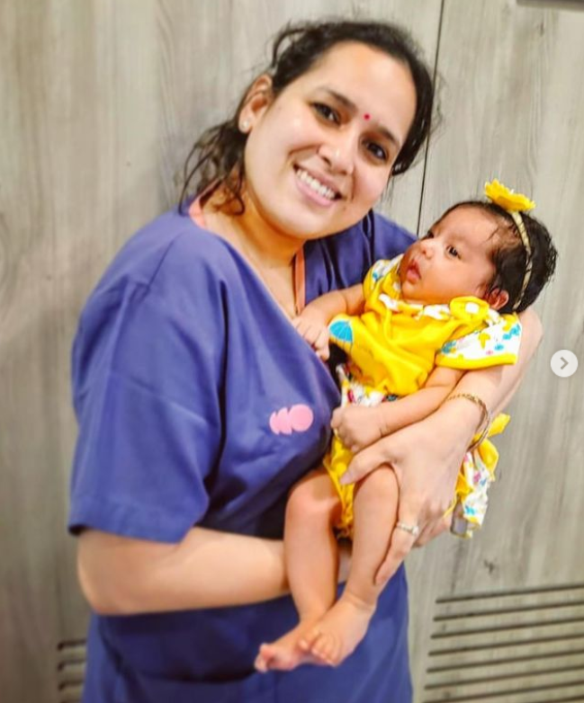 Dr. Prachi Benara holding a baby born after fertility treatment